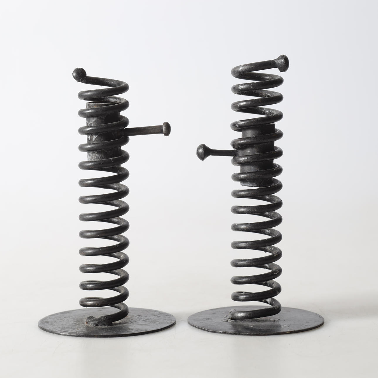 LJUSSTAKAR, 2 st, smide, 1900-tal.