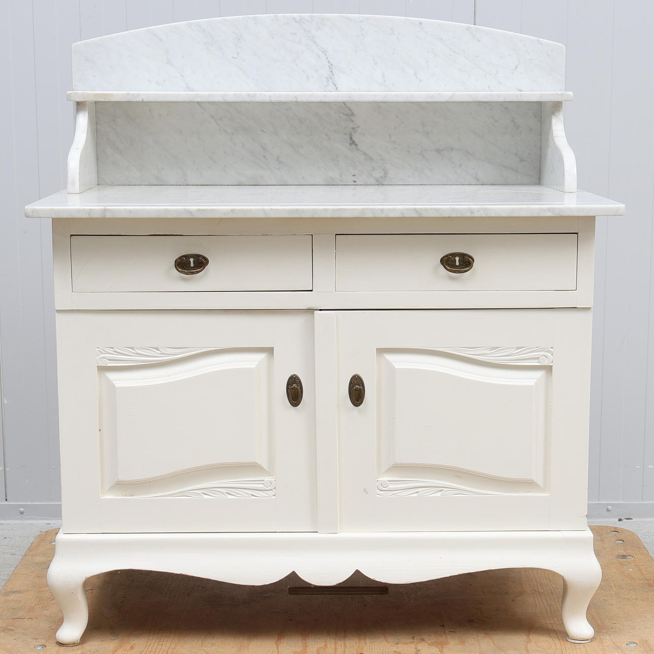 A lavoar with stone top, painted, 20th century.