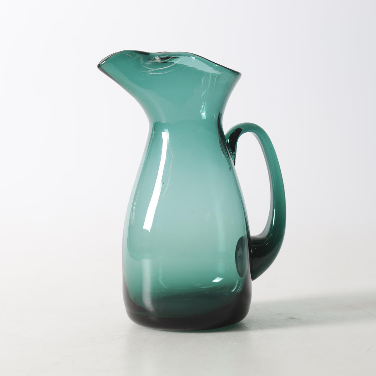 A glass jug, 20th century.