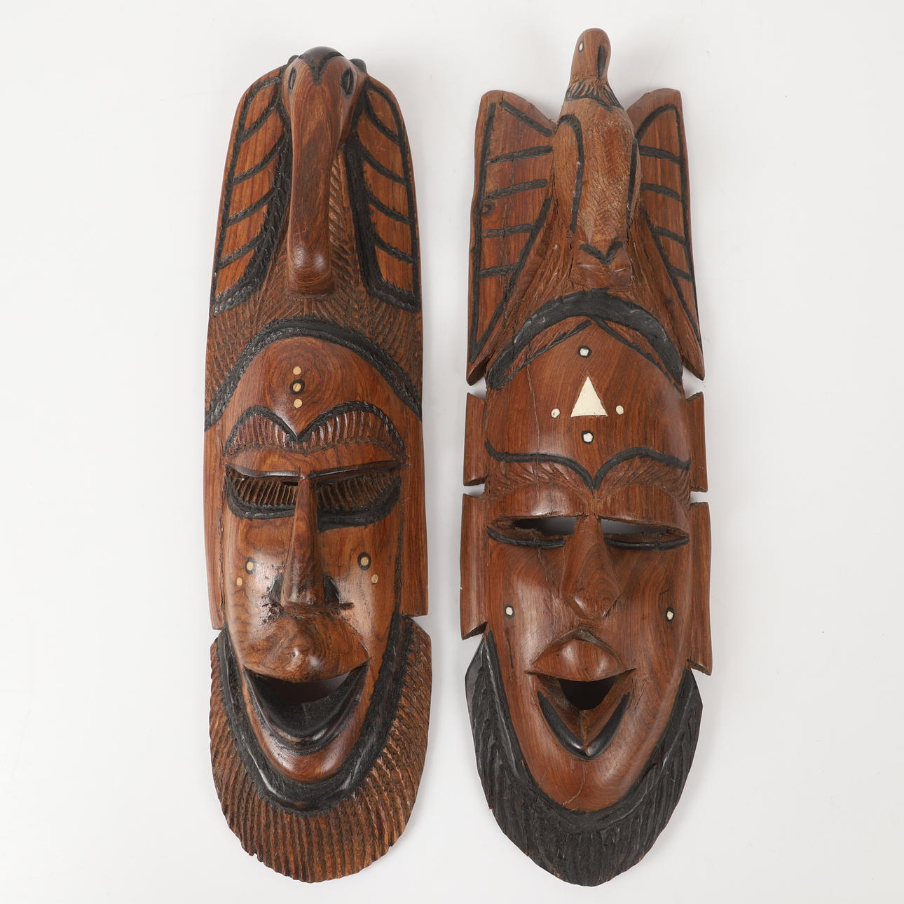MASKER, 2 stycken, skuret trä, Afrika.