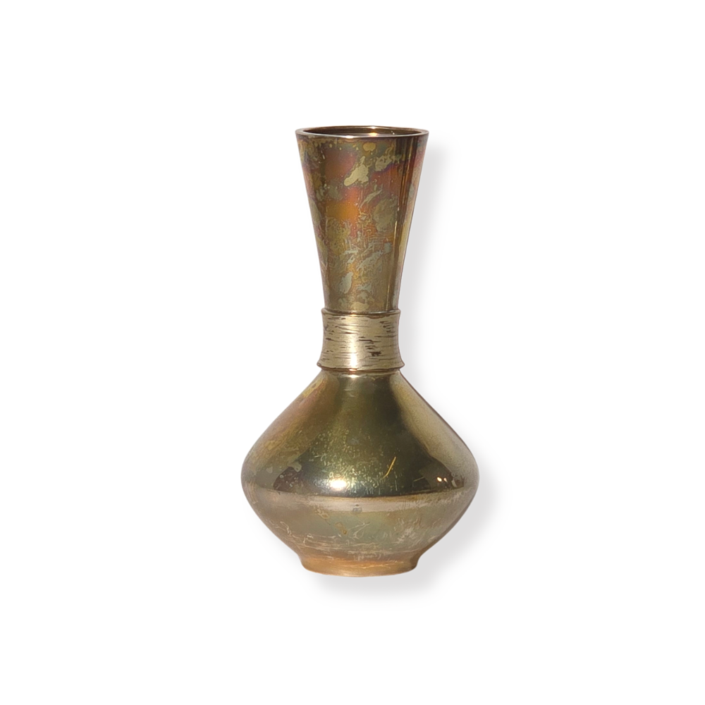 CLEAVAGE. VASE IN PUNCHED SILVER.