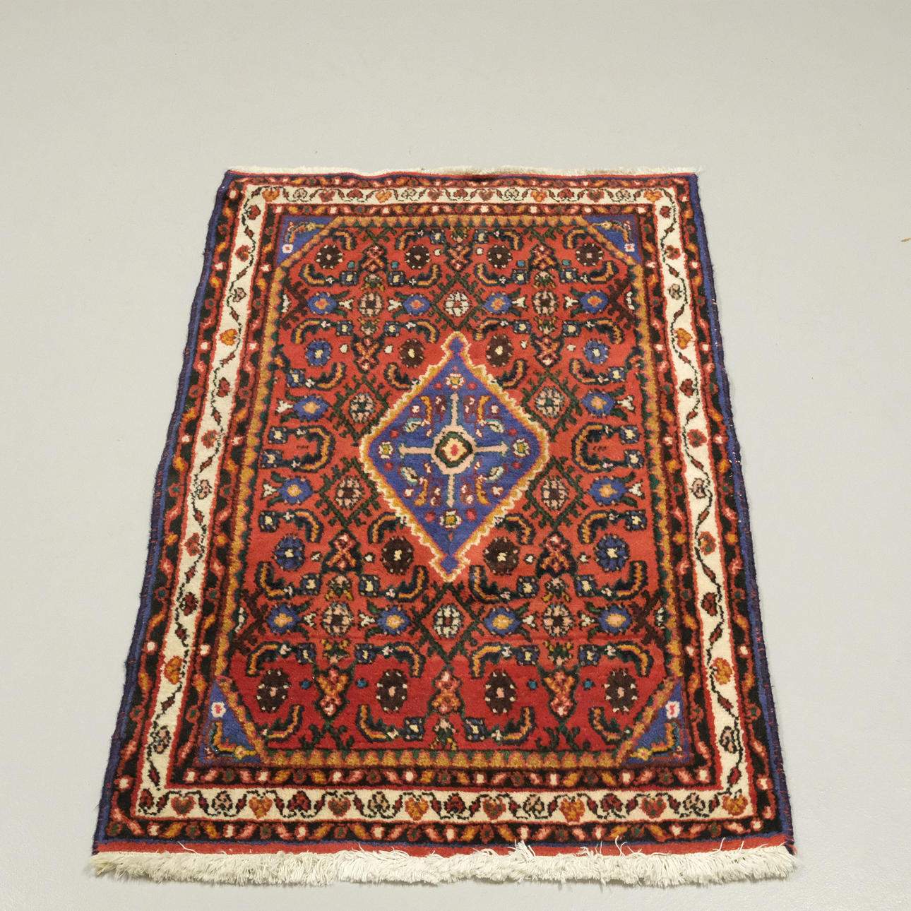 HAND-KNOTTED CARPET.