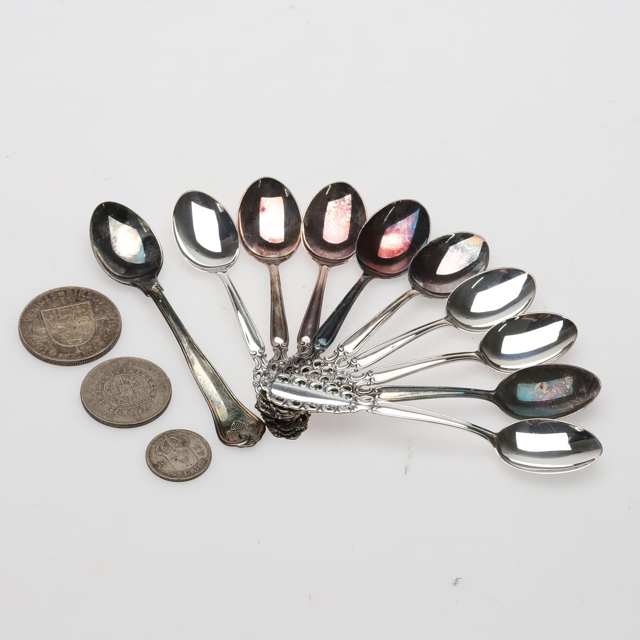 Silver spoons & coins, 157 grams.