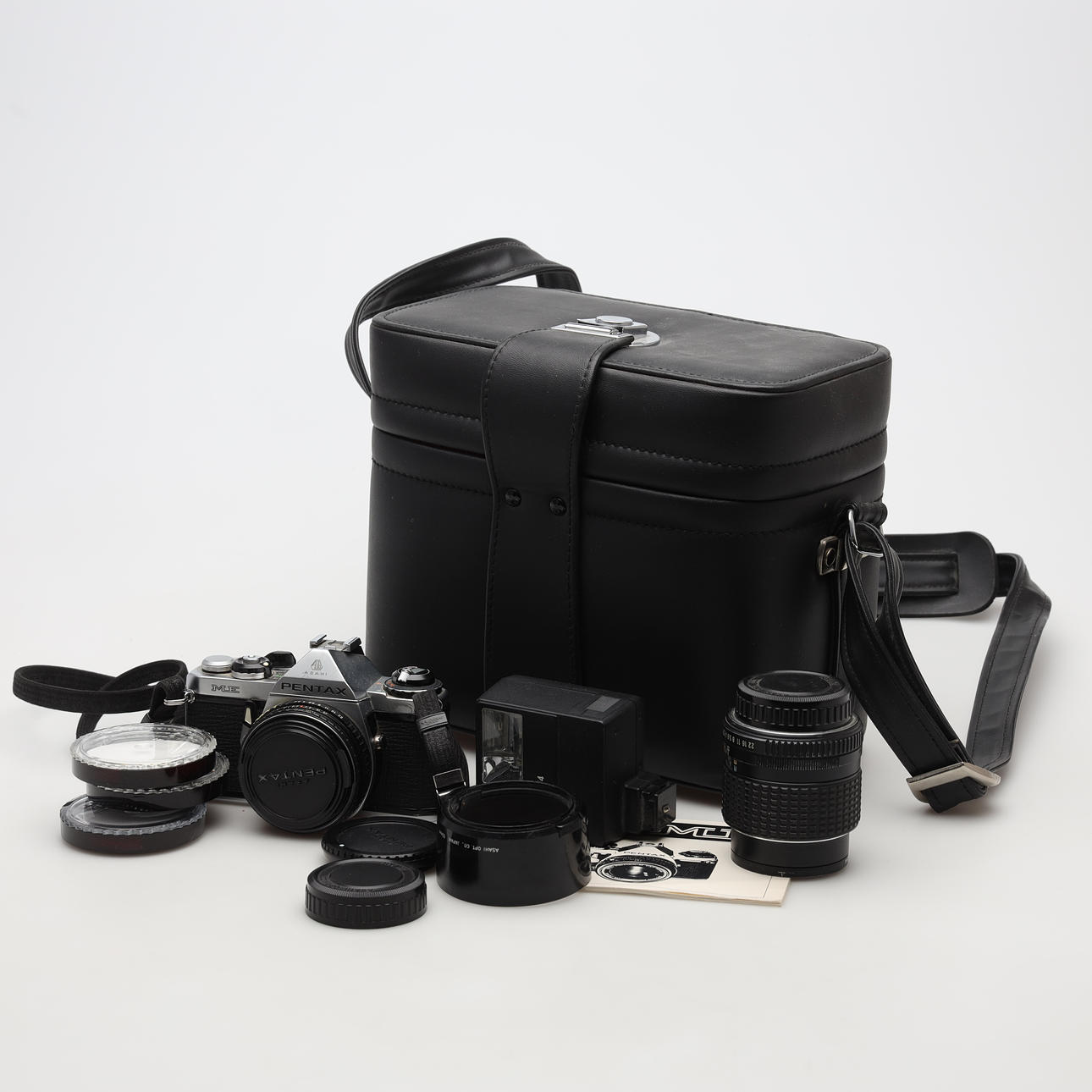 CAMERA with accessories, Pentax ME.