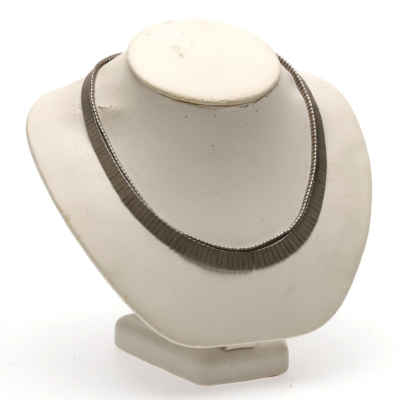 A pair of silver necklaces.