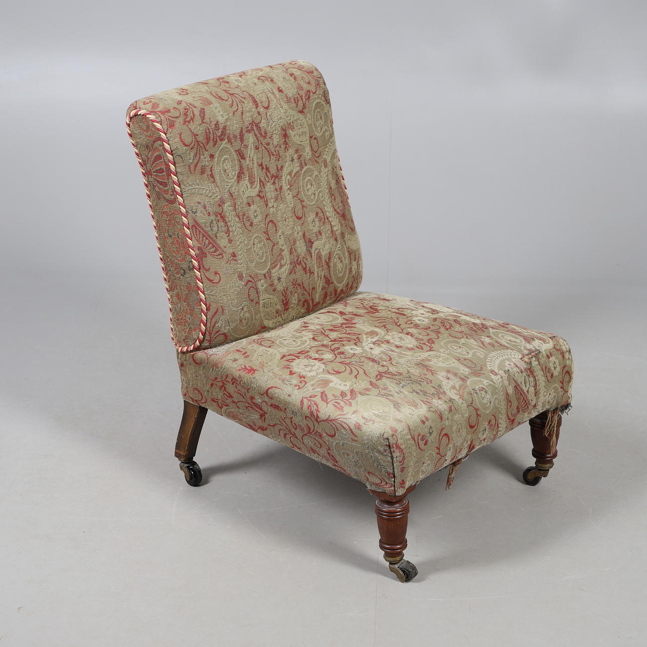 A VICTORIAN LOW SEAT CHAIR.
