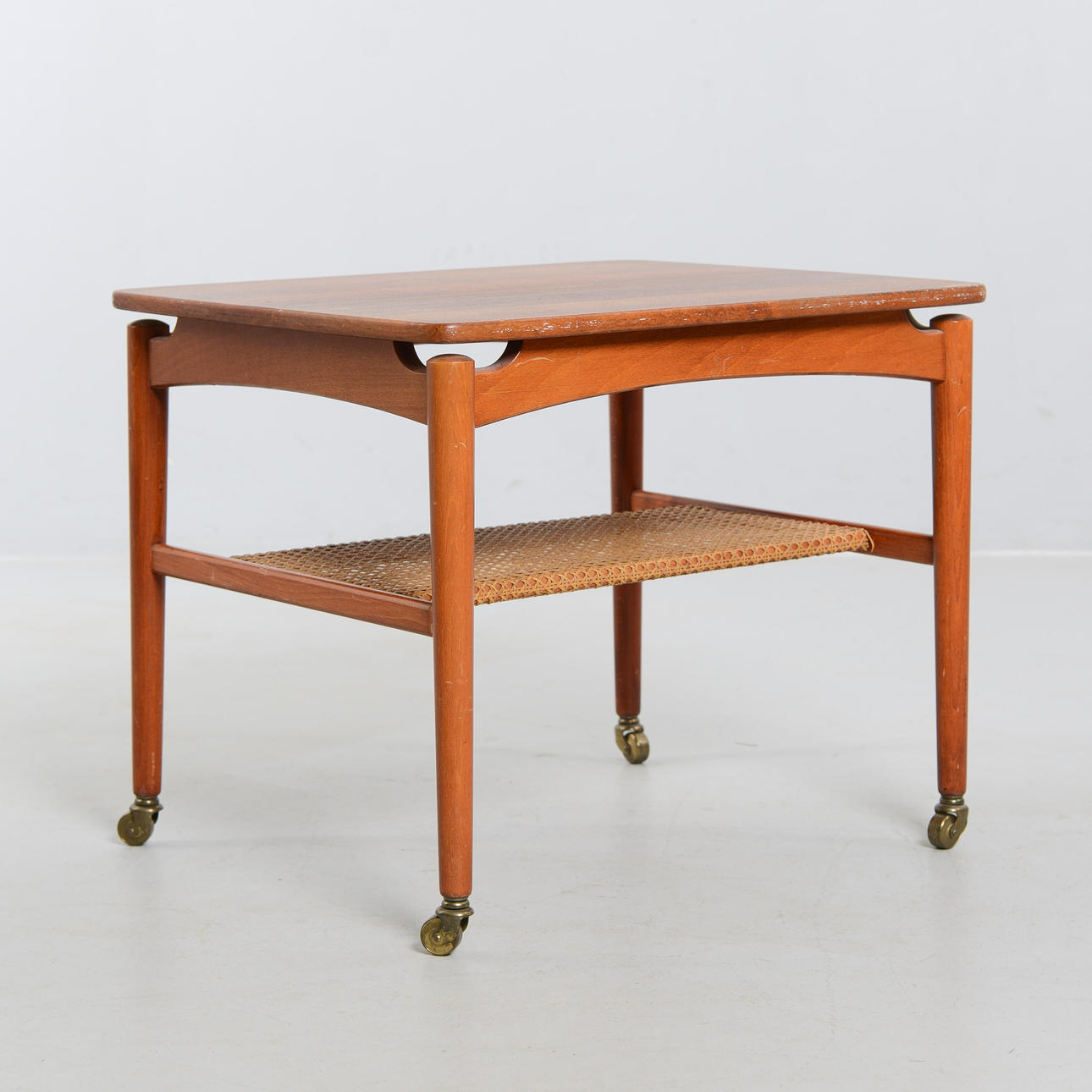 A side table, on wheels, mid 20th century.