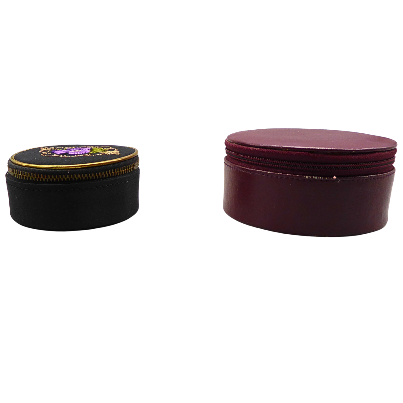 TWO ROUND JEWELRY CASES WITH ZIPPERS.