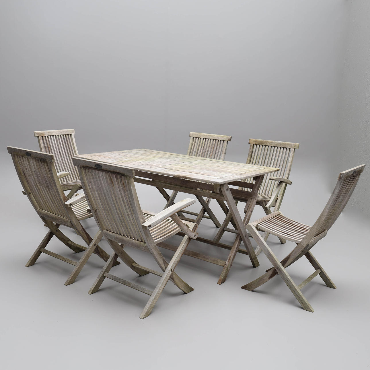 A 7-piece teak garden group, Brafab.