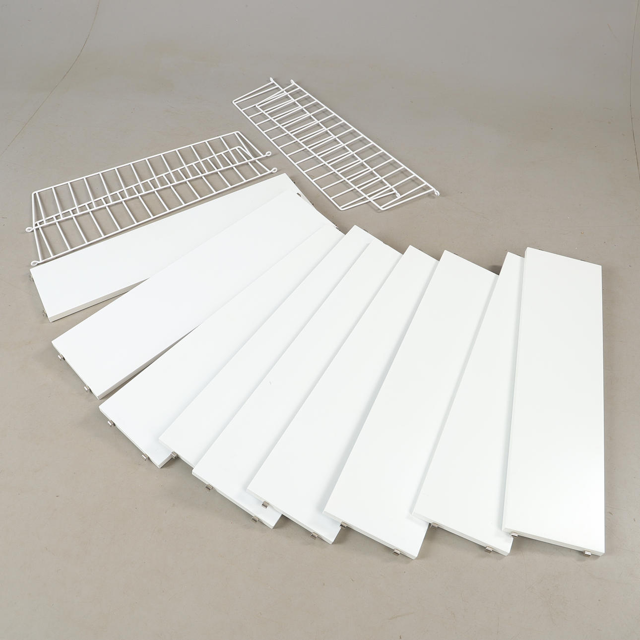 NILS & KAJSA STRINNING. Wall shelf, white lacquered, String Design, 2000s.