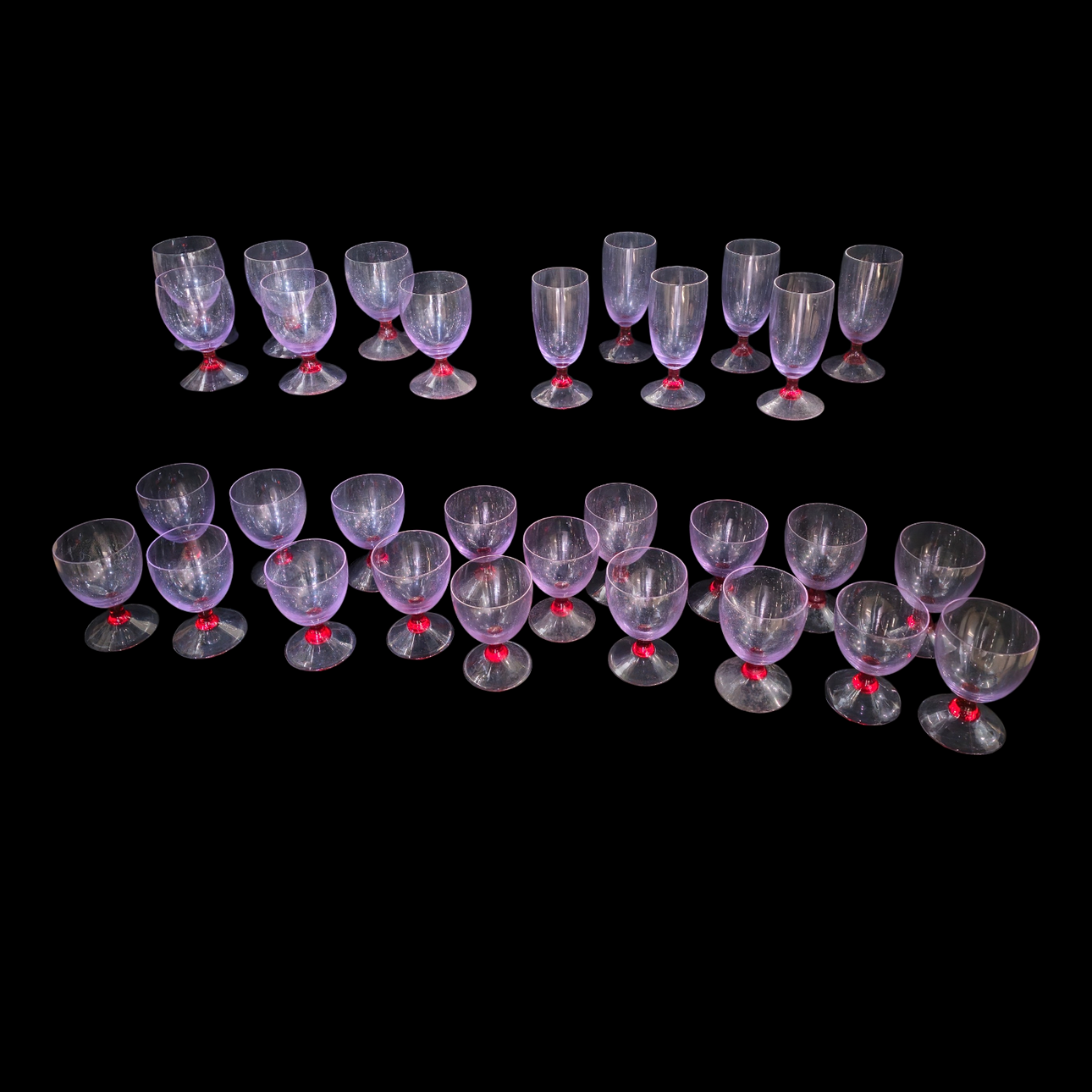 Blown glass in violet and red tones.