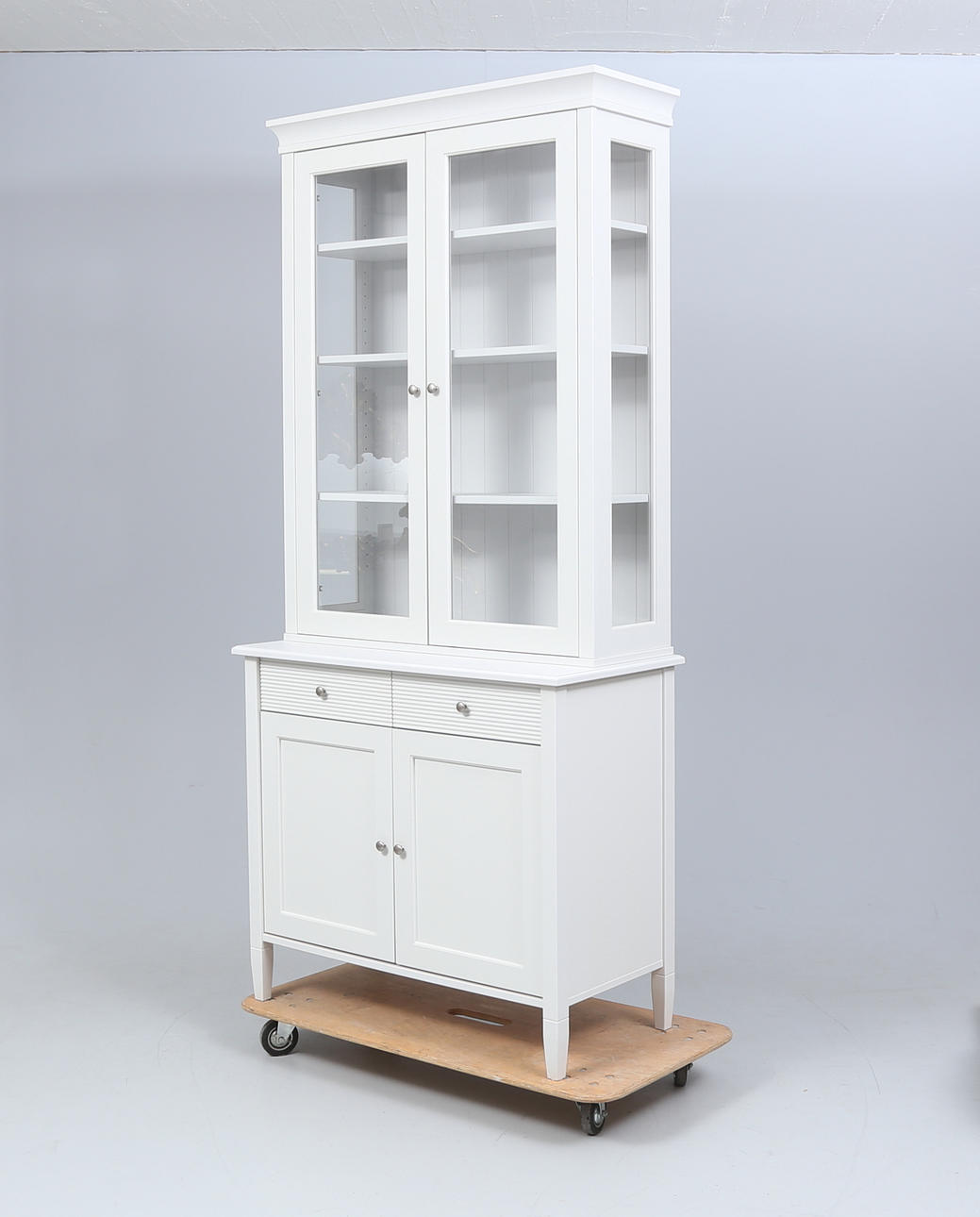 A contemporary painted display cabinet.