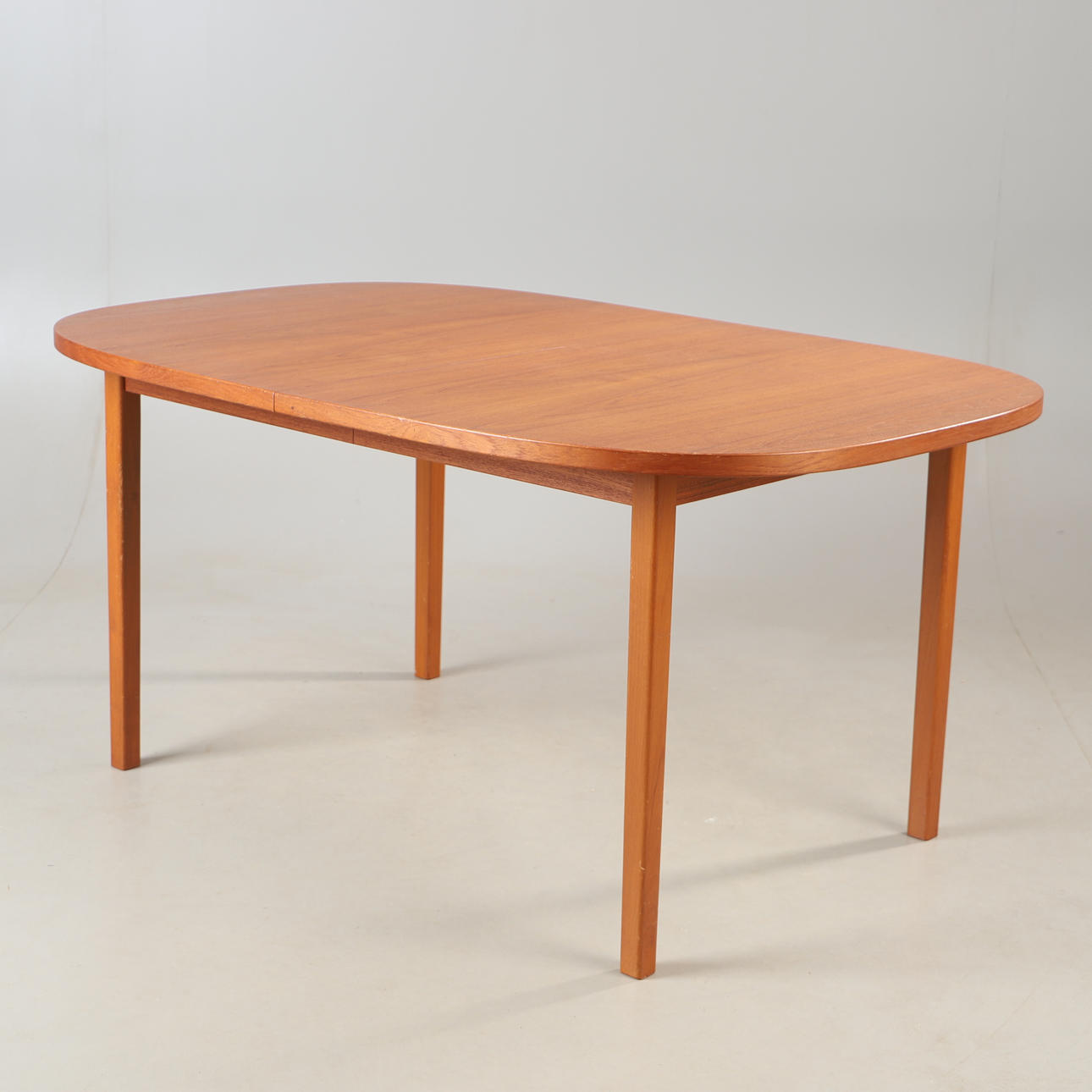 A teak dining table, mid 20th century.