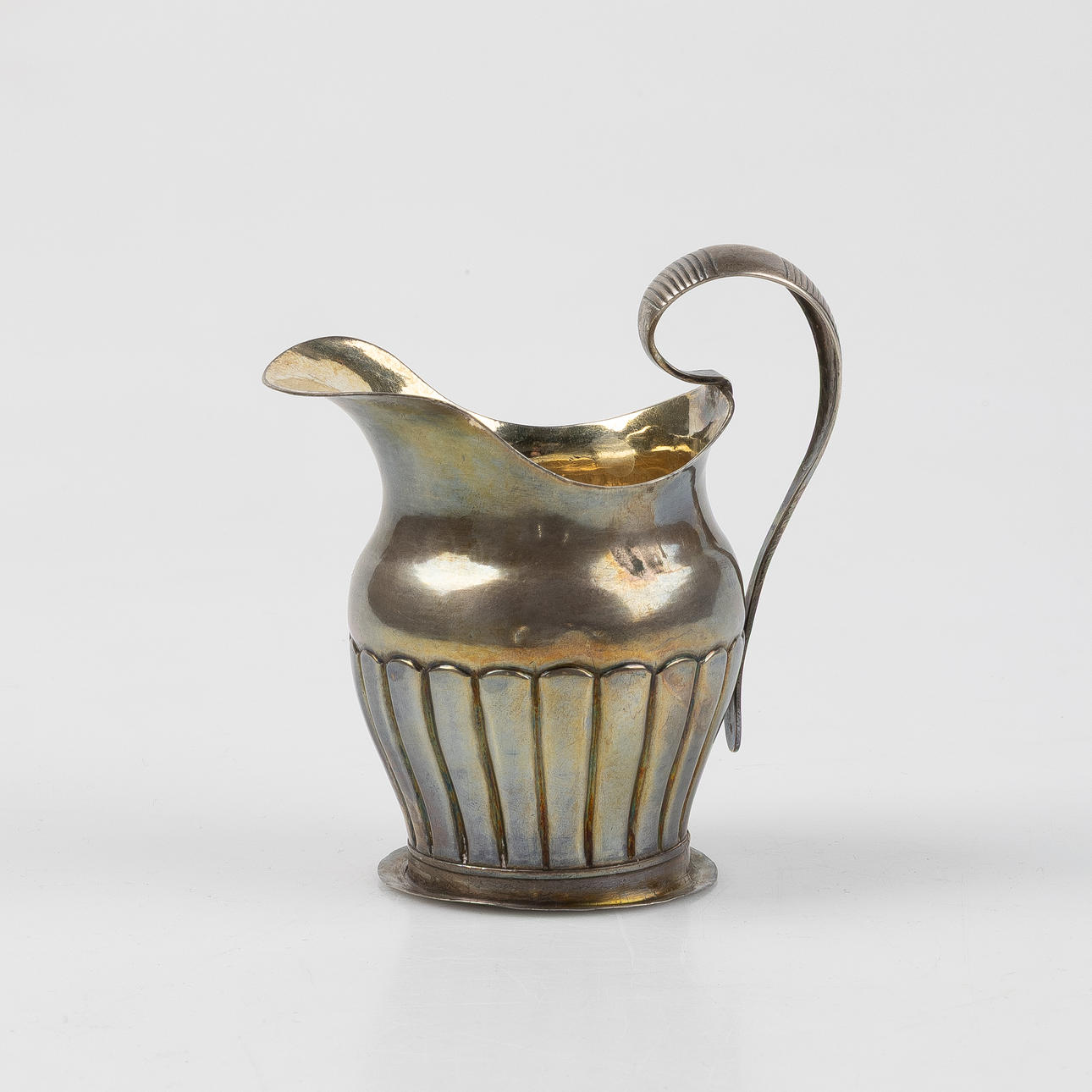 A SILVER CREAM JUG, AGH, 1862.