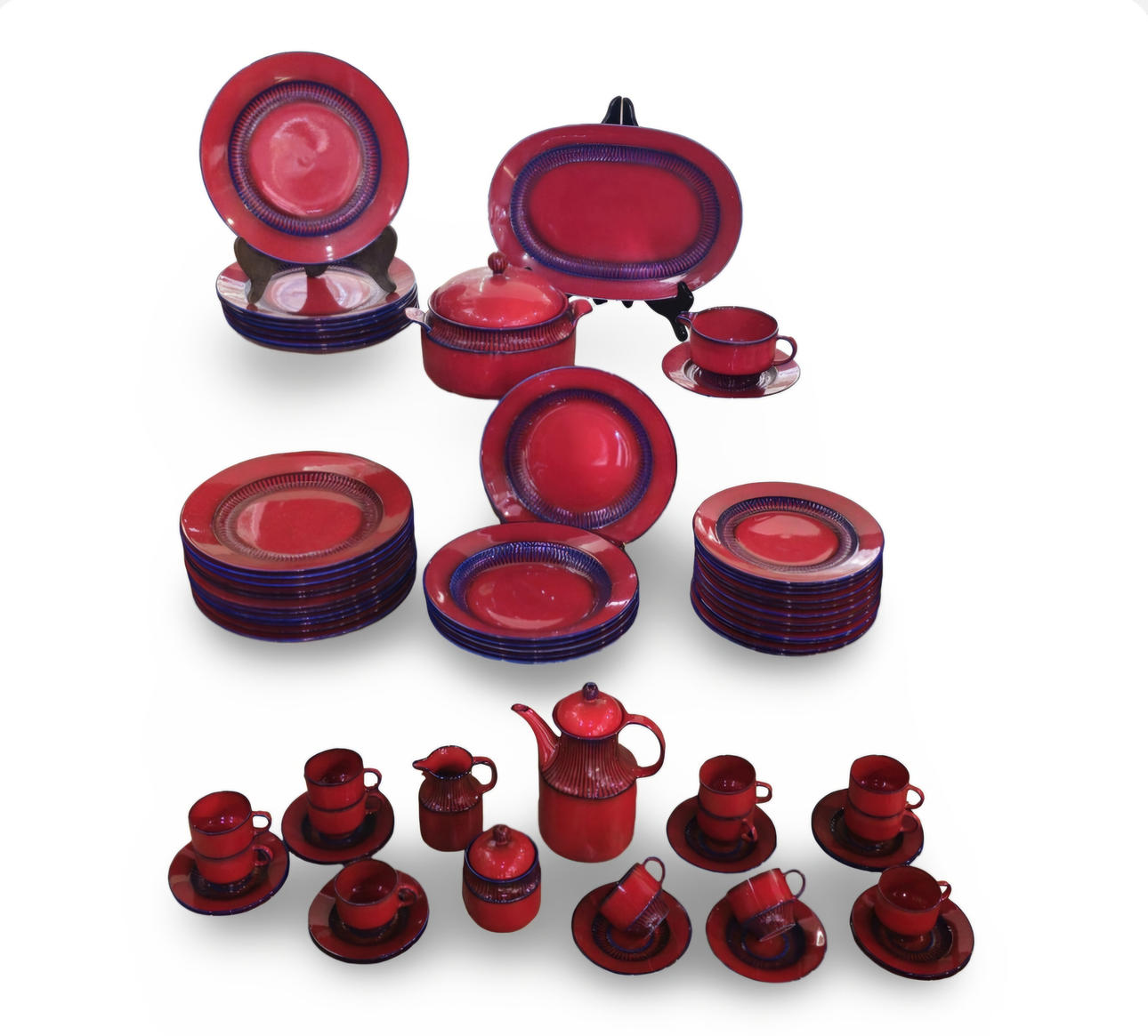 Red glazed porcelain tableware with blue plated detail.