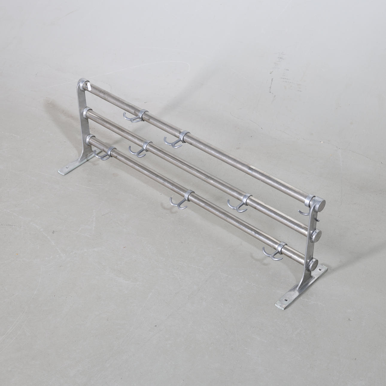 A metal hat shelf, mid 20th century.