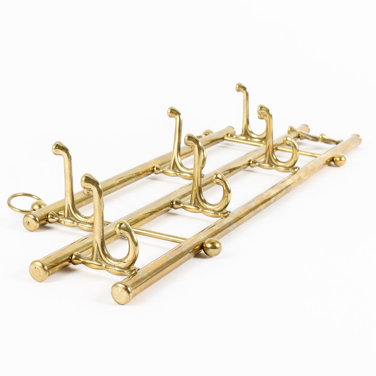 A 20th-century brass clothes hanger.
