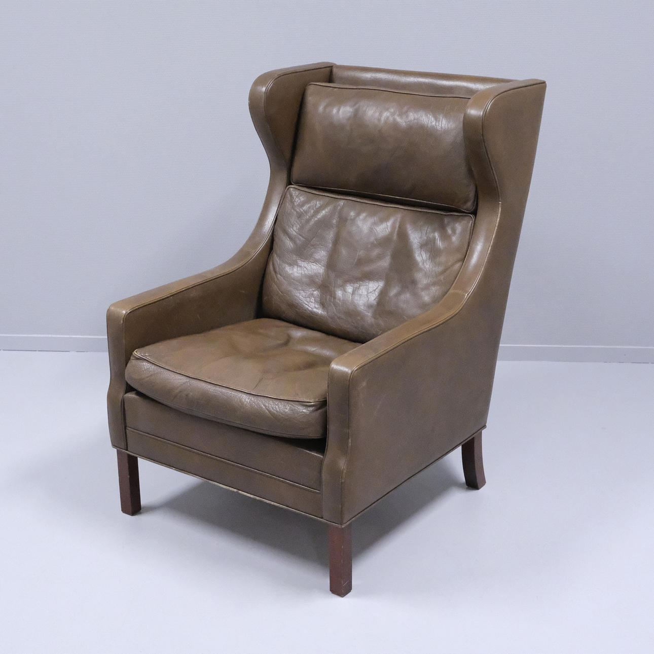 ARMCHAIR, BROWN LEATHER.