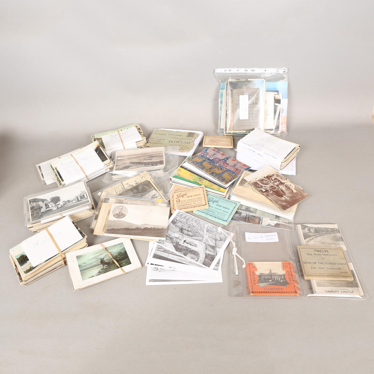 A COLLECTION OF MOSTLY EARLY 20TH CENTURY POSTCARDS (QTY). Books, Maps ...