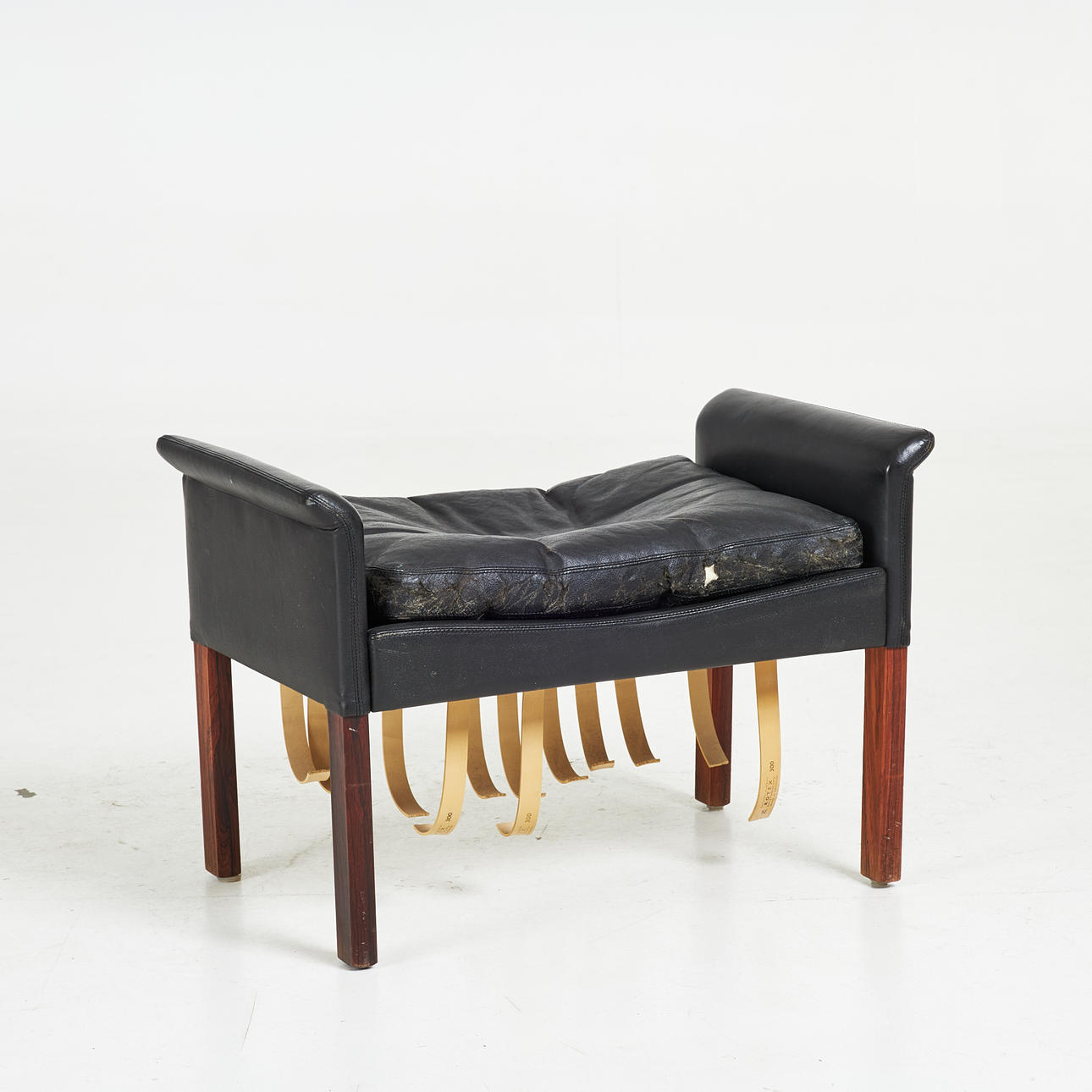 HANS OLSEN. A 1960s black leather stool, Denmark.