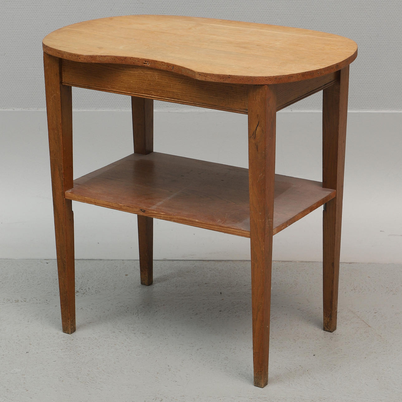 A 20th-century oak table with base.