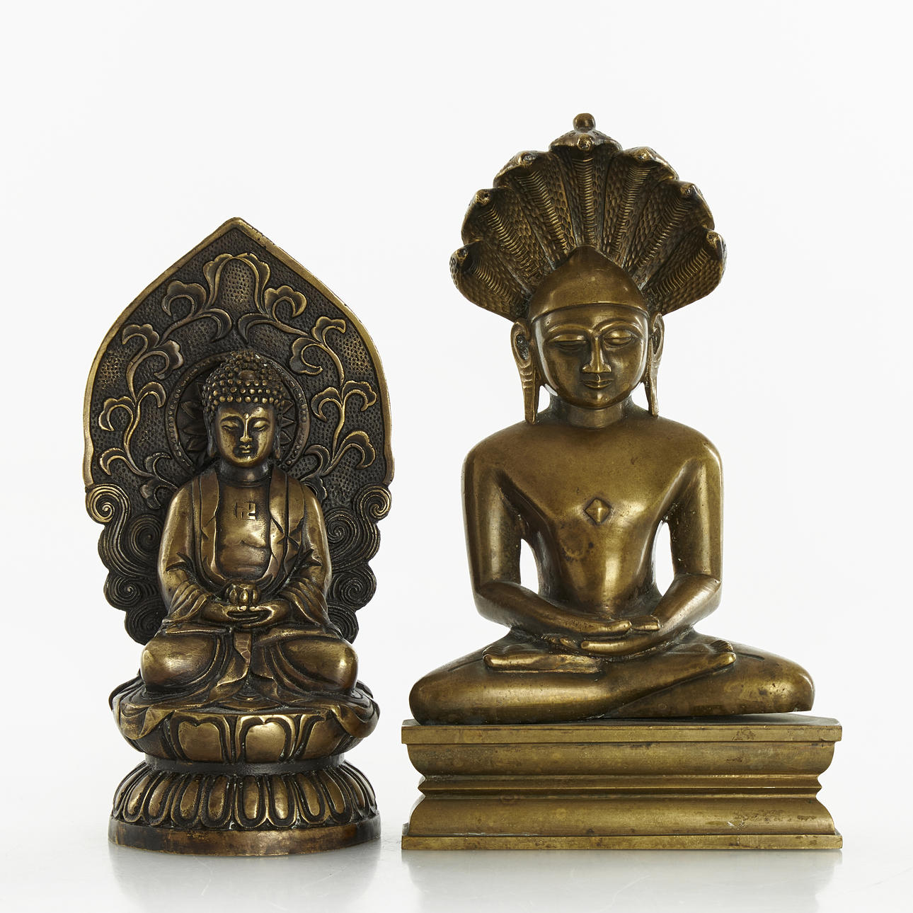 Two copper/bronze alloy Buddhas, 20th century.