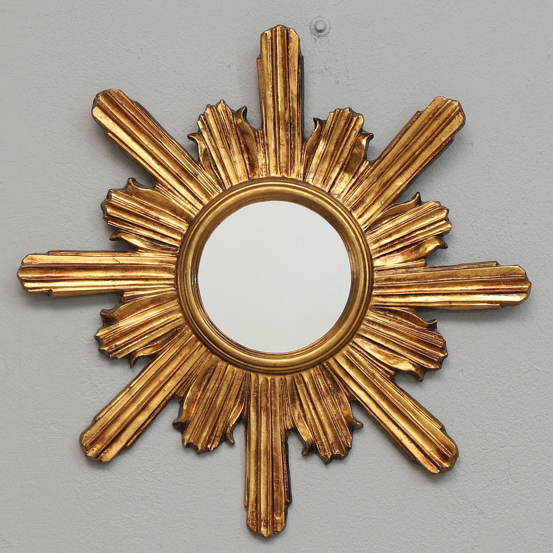A sun mirror, wood-plaster frame, 20th century.