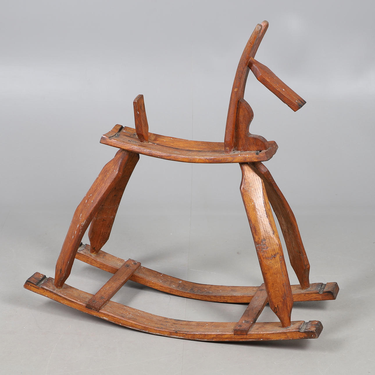 A RUSTIC PINE ROCKING HORSE.