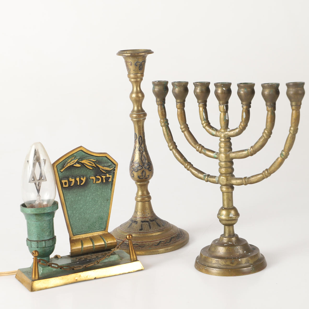 CANDLESTICKS M. M., 3 pieces, brass, 20th century.