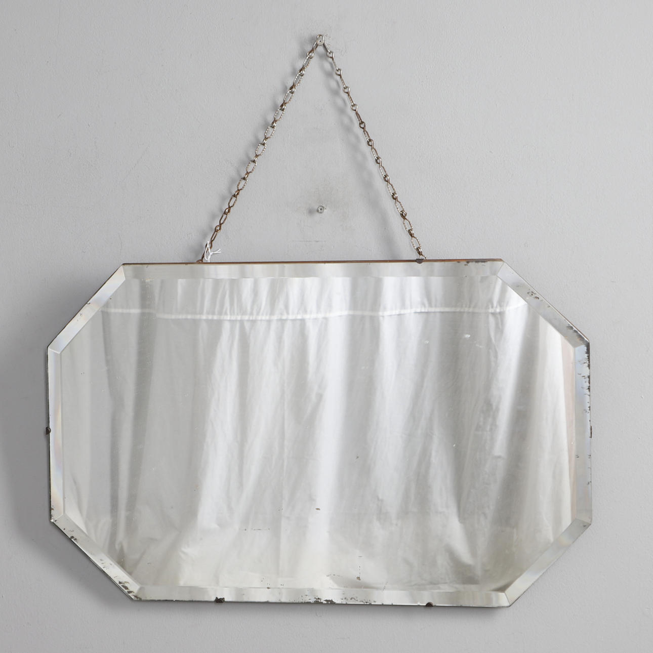 ART DECO HEPTAGONAL WALL MIRROR.