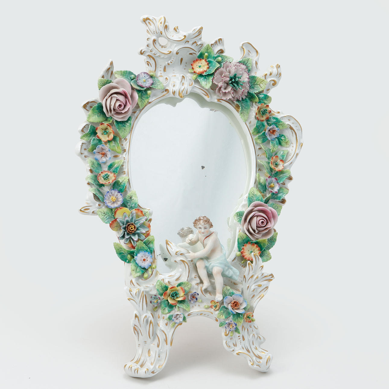 A porcelain table mirror, Sitzendorf.