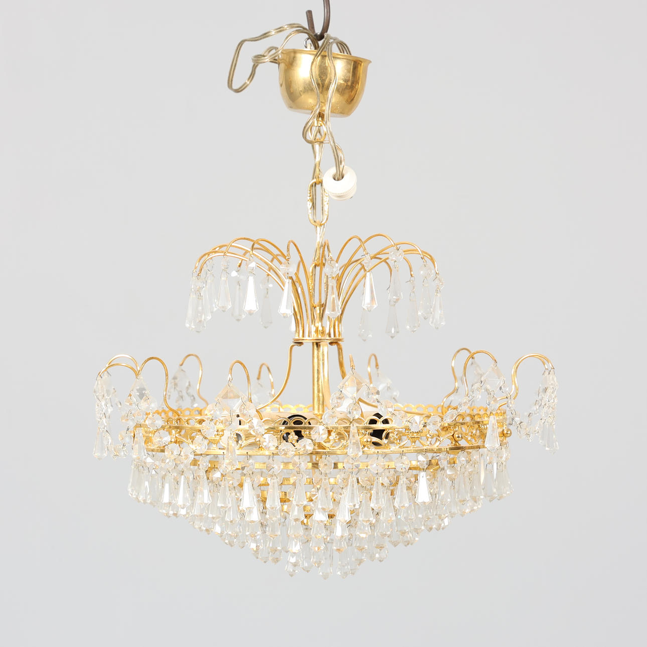 A metal ceiling lamp and prisms, 20th century.