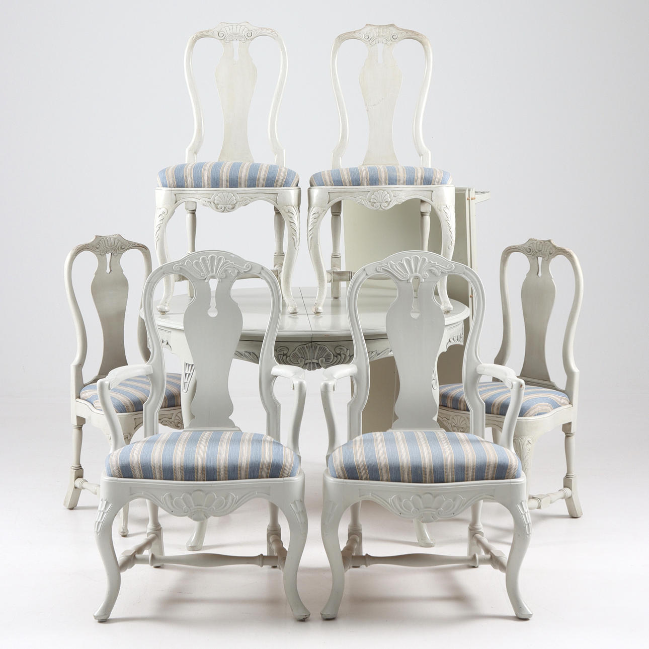 A 7-piece rococo style dining group, 20th century.