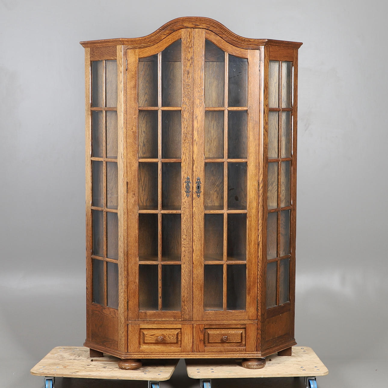 AN OAK GLAZED CABINET.
