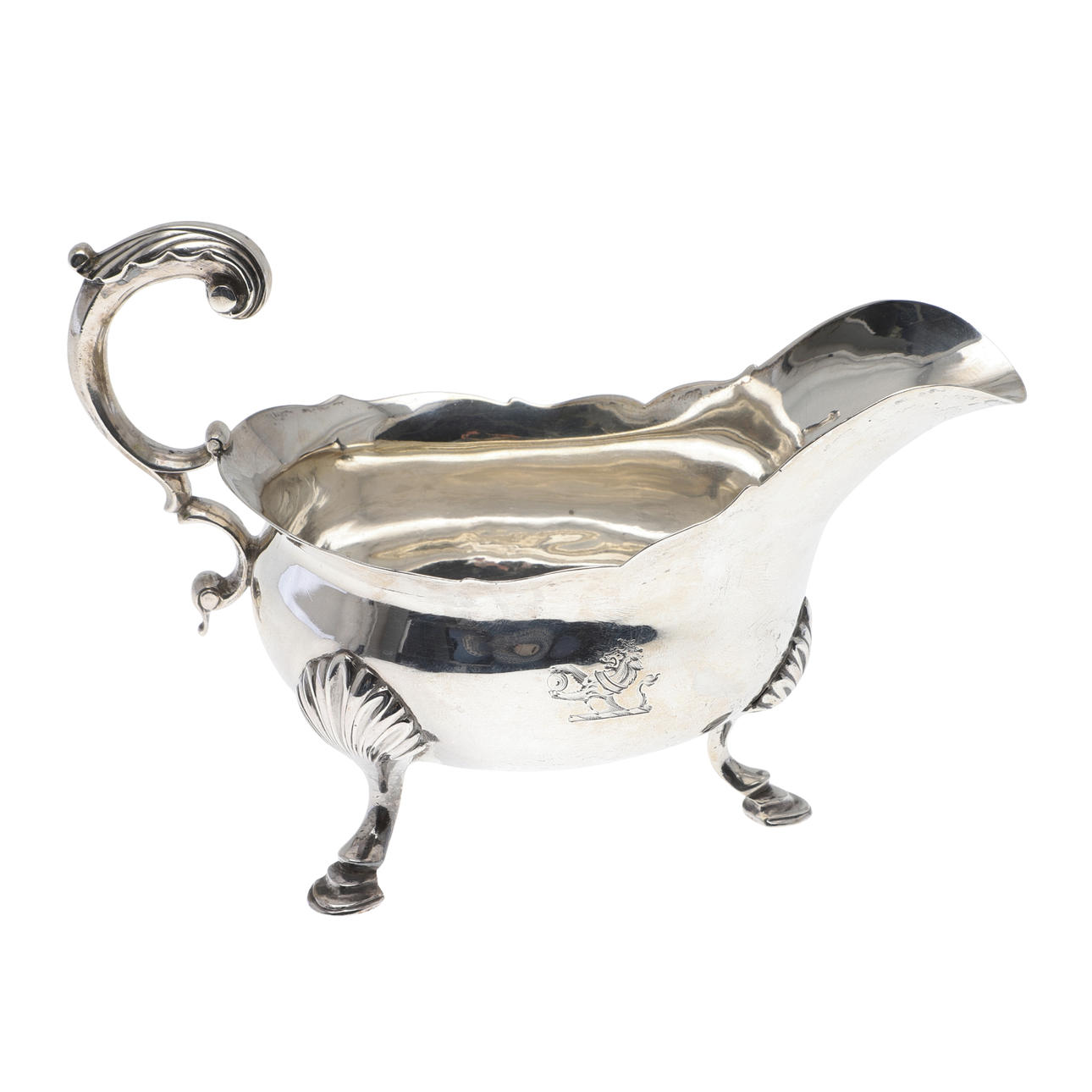 A GEORGE III SILVER SAUCE BOAT.