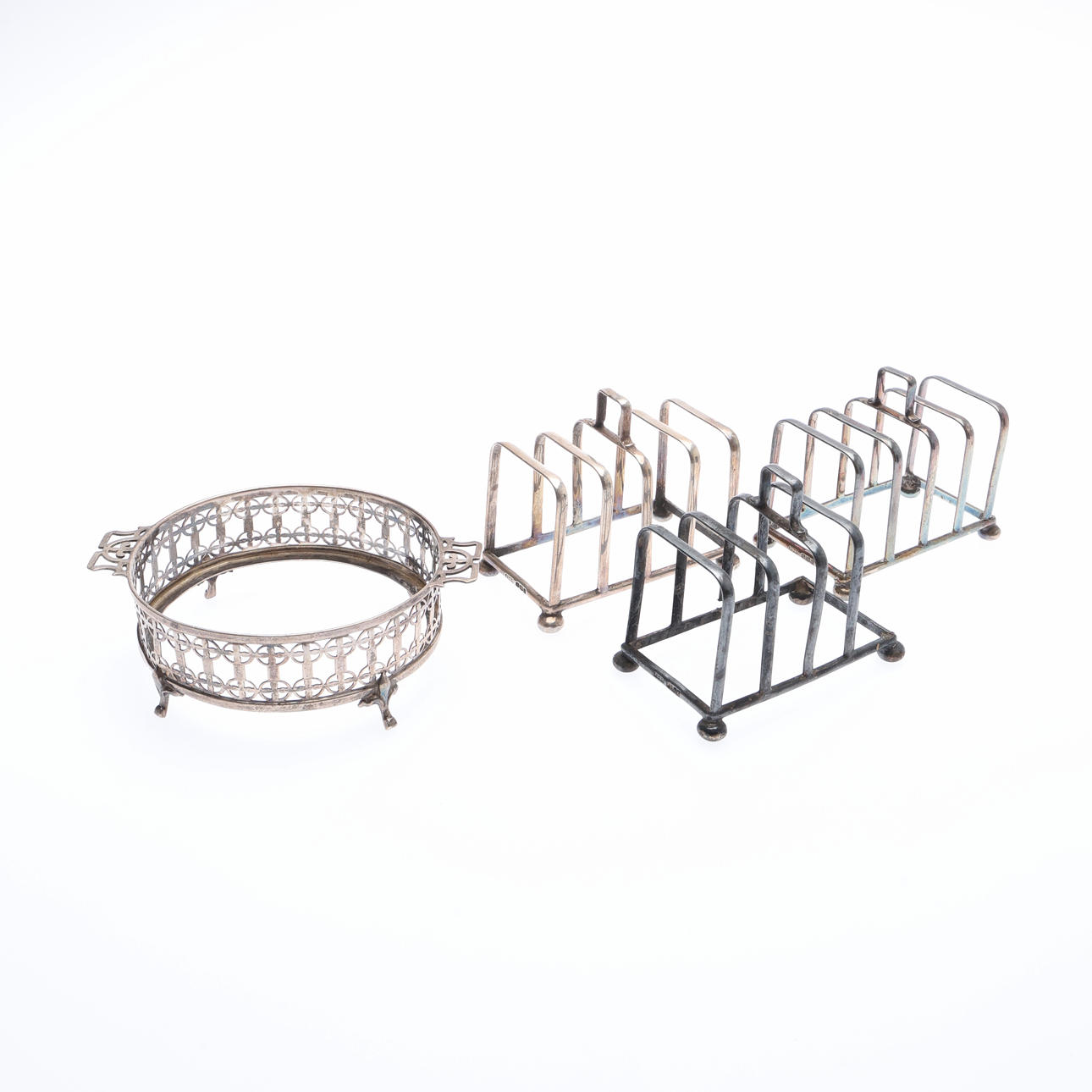 SET OF 3 GEORGE V SILVER TOAST RACKS, AND A BUTTER DISH HOLDER. (4 ...