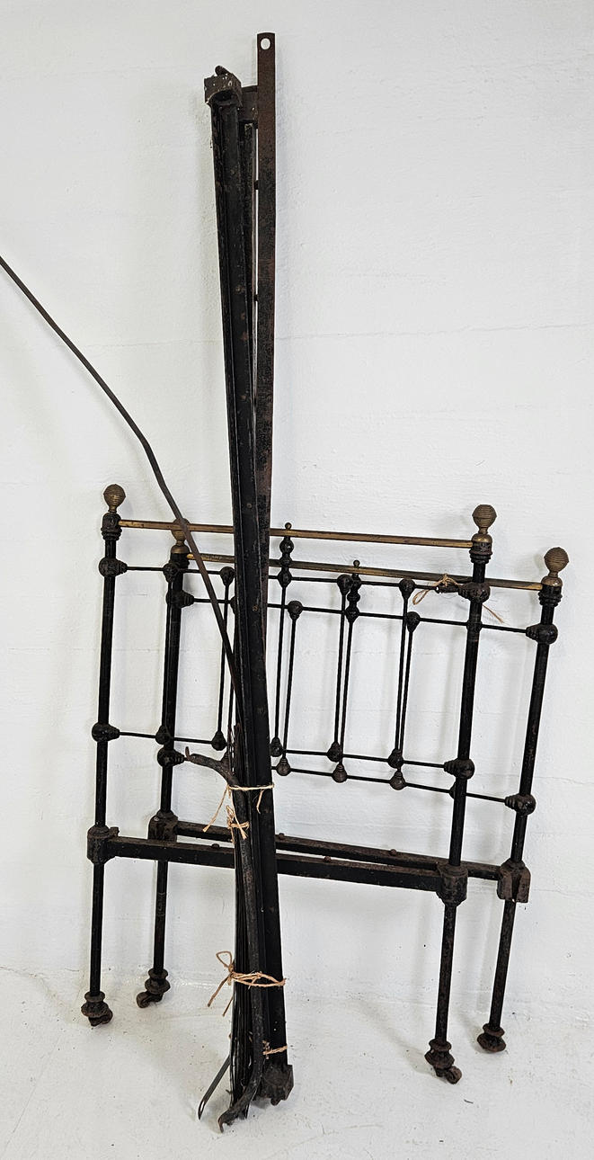 An 18th/20th century iron bed.