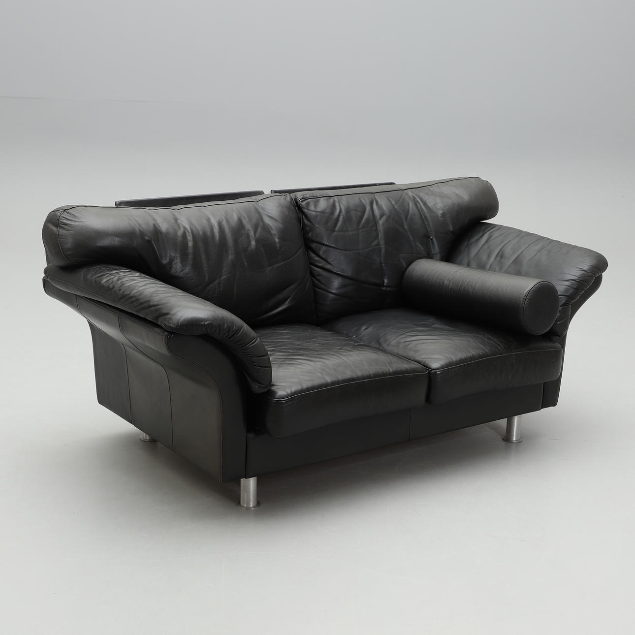 A sofa, black leather upholstery, 1900/2000s.