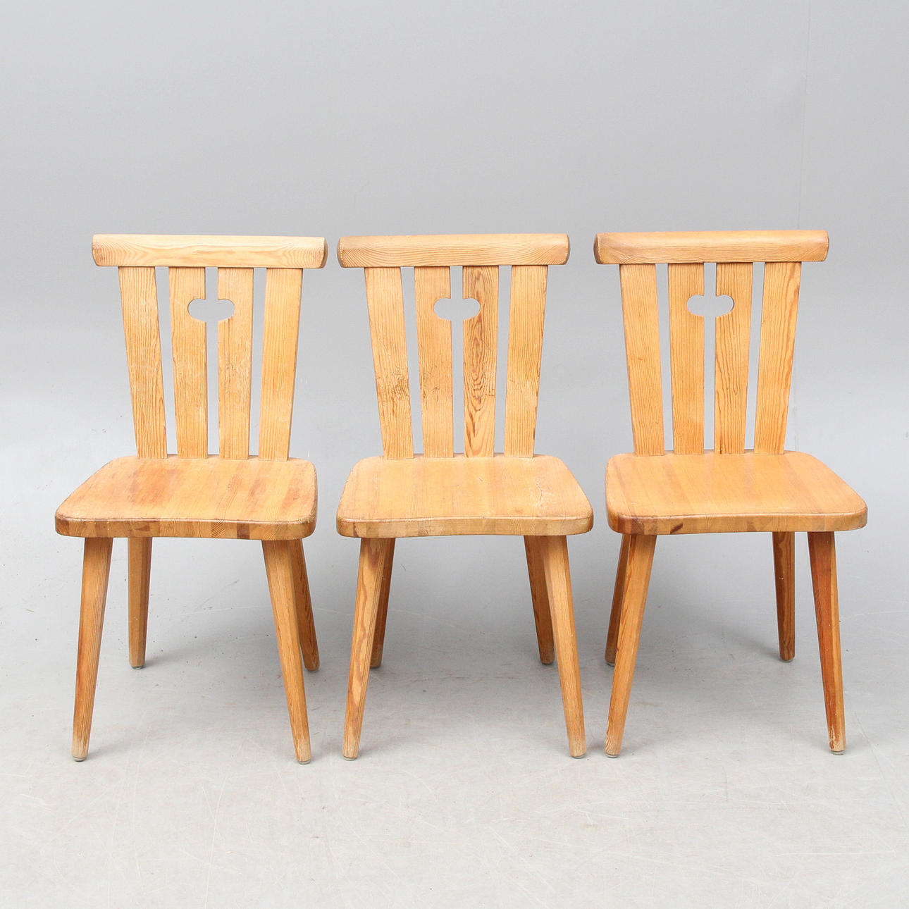 A set of 3 pine chairs.
