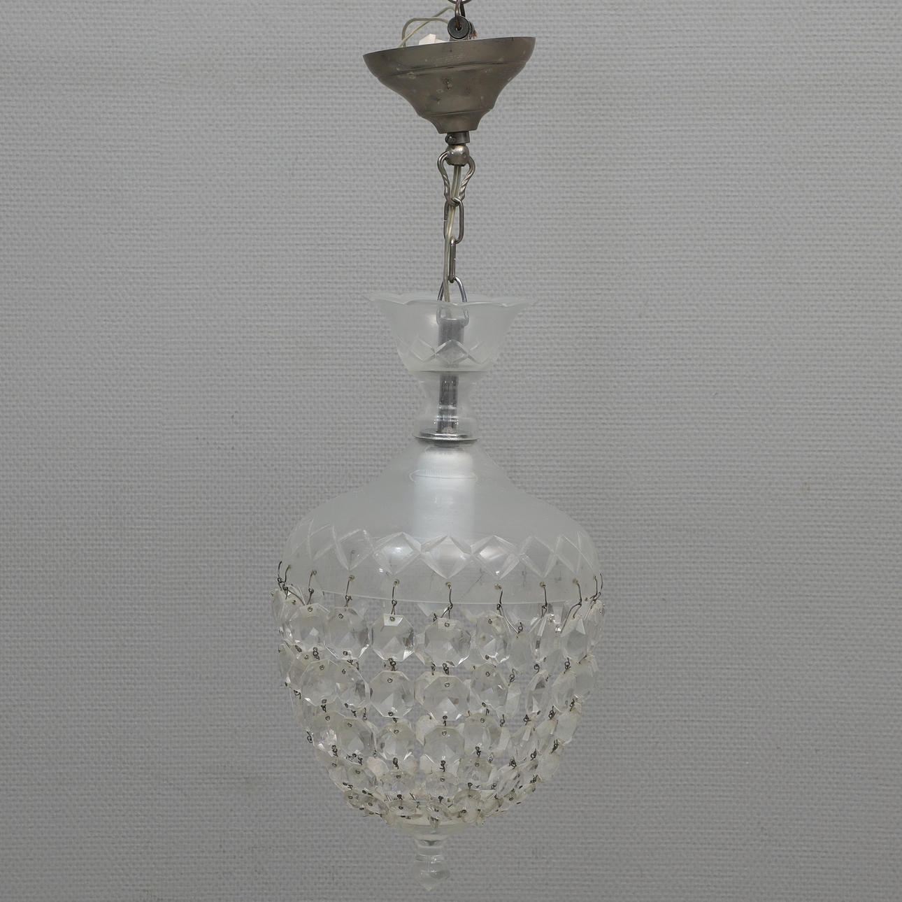 A 20th-century glass/prism ceiling lamp.