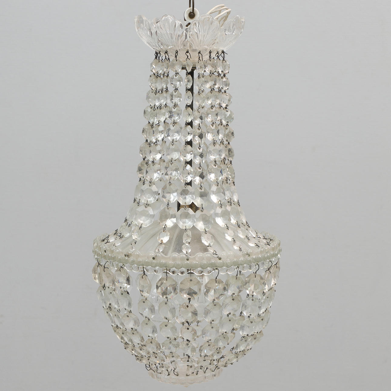 A 20th-century ceiling lamp with prisms.