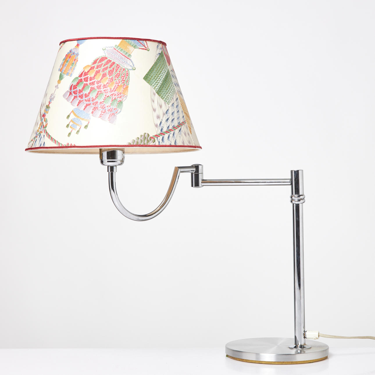TABLE LAMP, EWÅ, model B-73, chromed frame, adjustable arm, screen decorated with tassels, label.