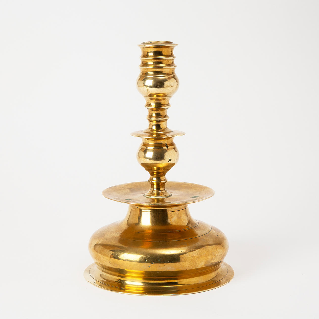 A baroque brass candlestick, 16th/18th century.