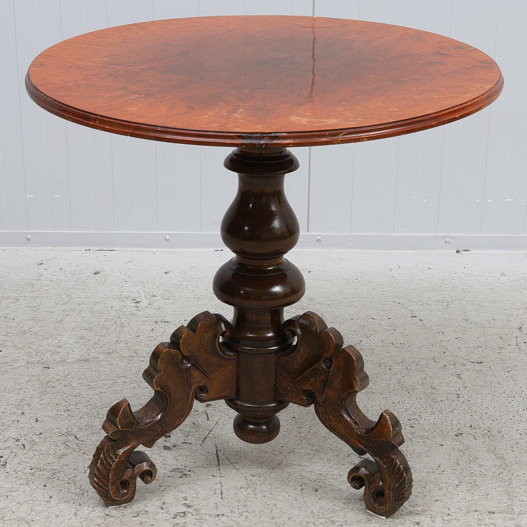 A 20th-century baroque pillared table.