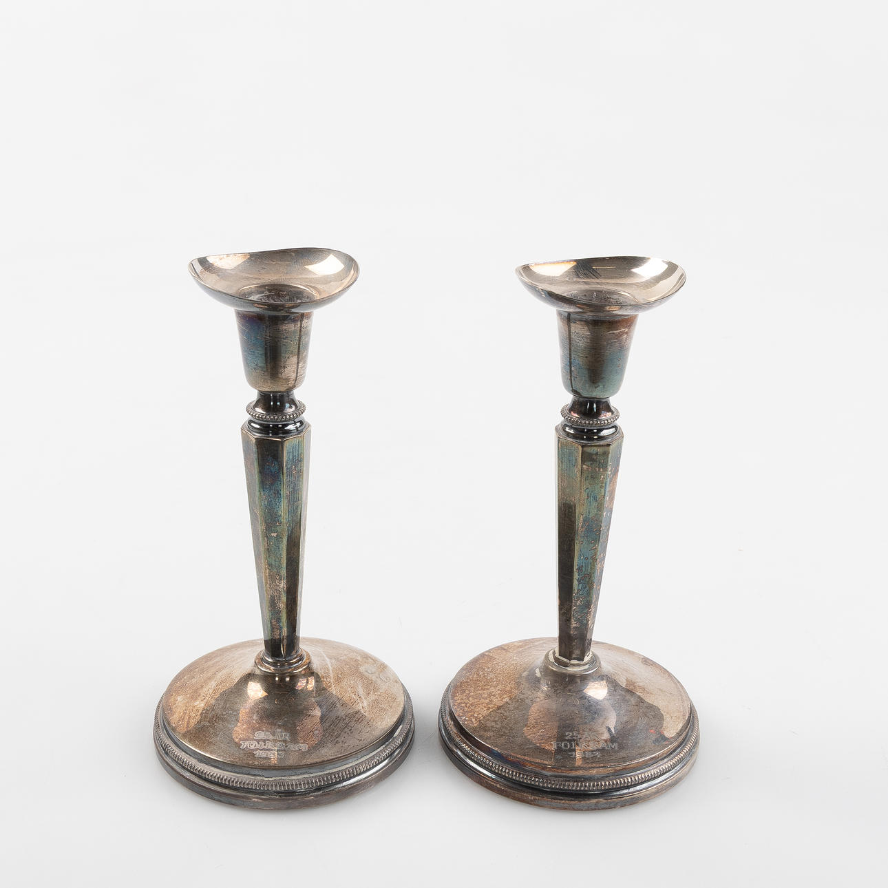 A pair of candlesticks, MGAB, 1983.