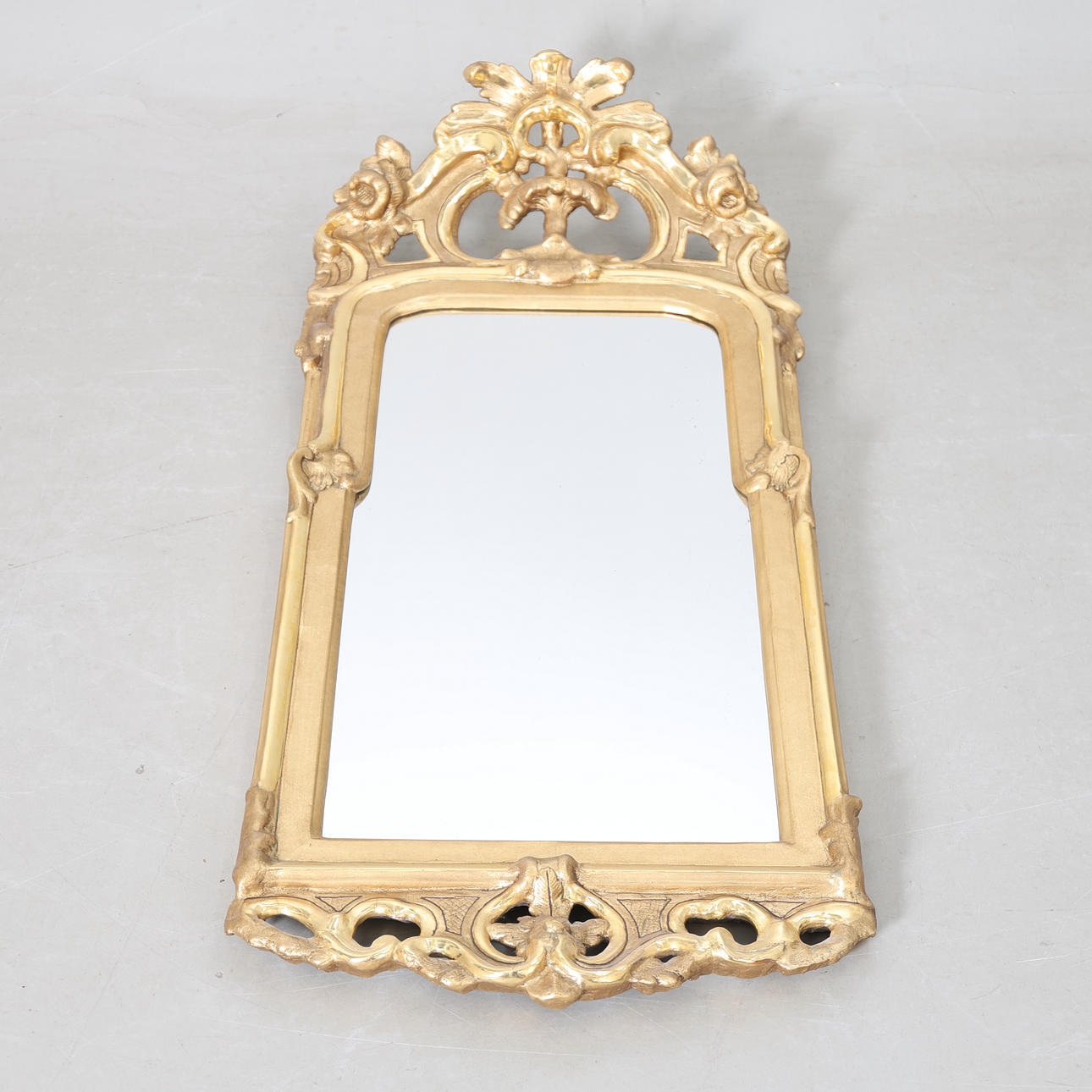 A 18th-century rococo gilt & bronzed mirror.
