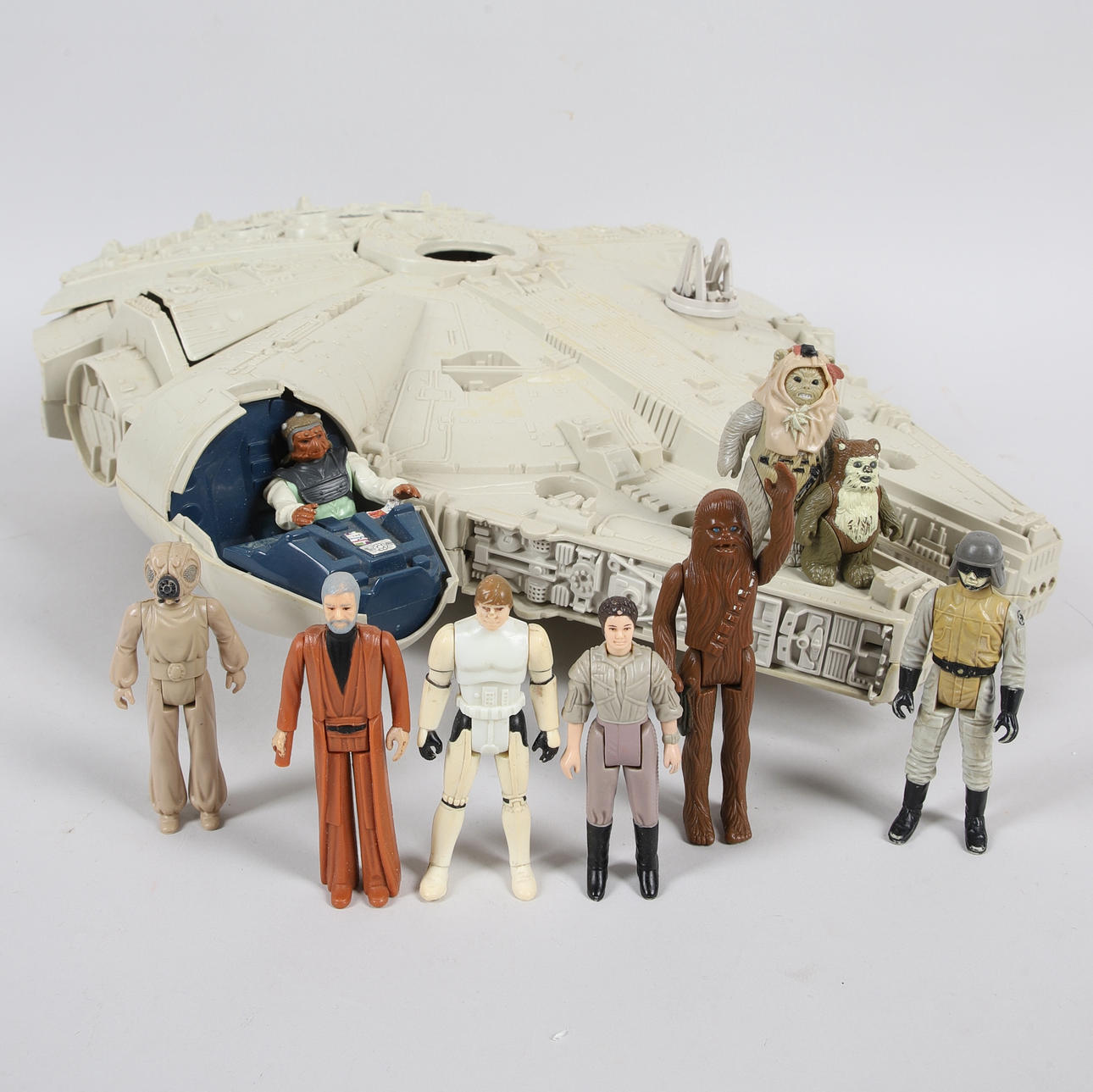 STAR WARS, Millenium Falcon & 9 figures including Luke Skywalker “Stormtrooper in Disguise”, Kenner Products, 1979-1984.