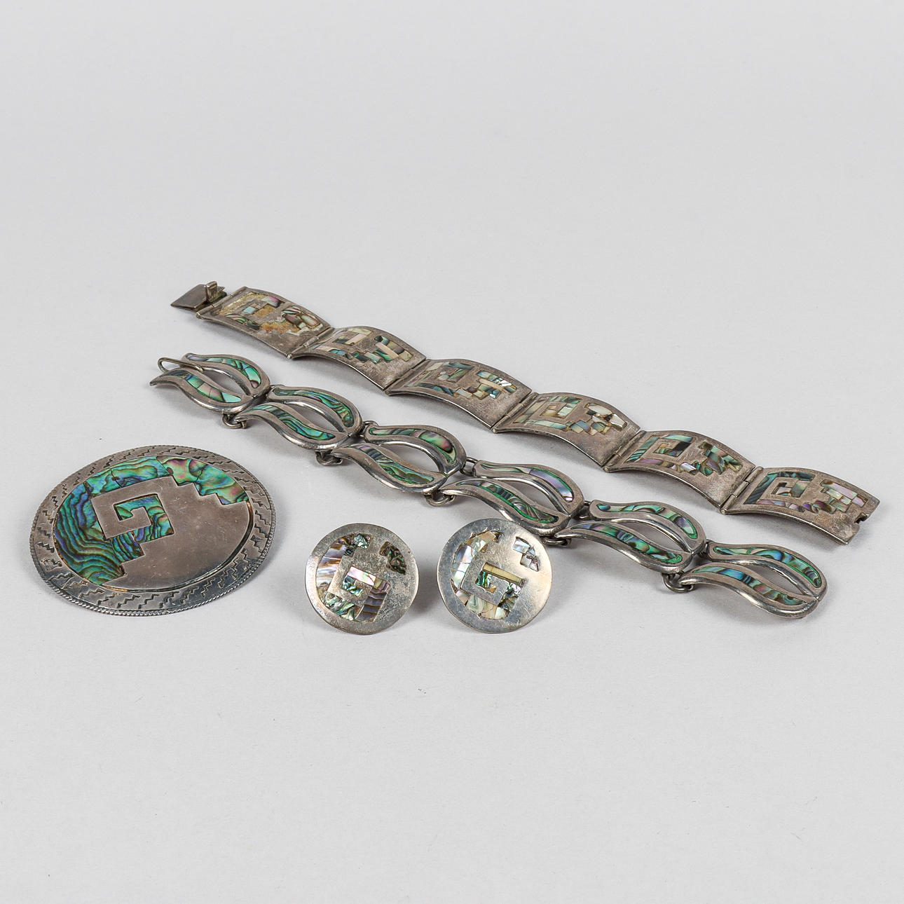 A SILVER JEWELLERY with abalone shell inlay, Mexico.