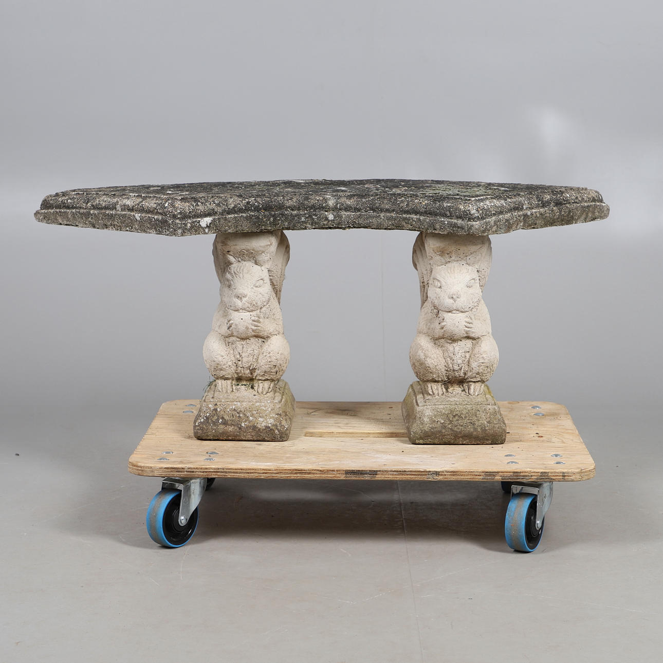 A CONCRETE SQUIRREL BENCH.