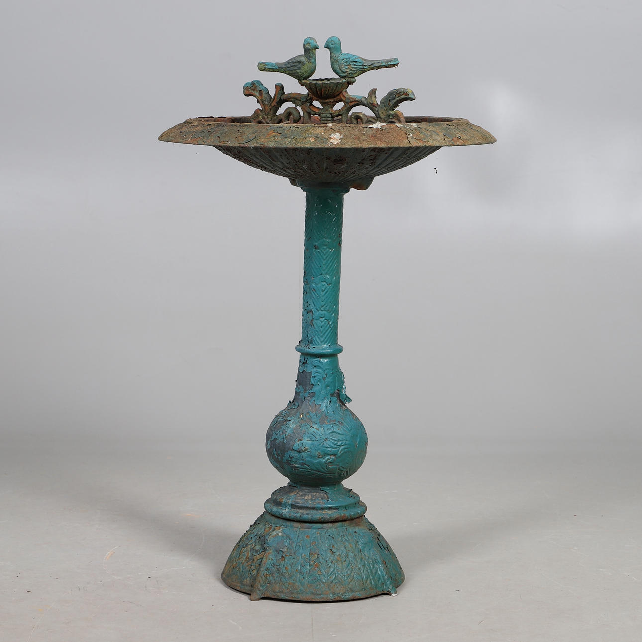 A VICTORIAN CAST IRON BIRD BATH.